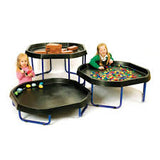  Two young girls using 3 black active world trays on top of 3 adjustable active world tray stands at varying heights. 